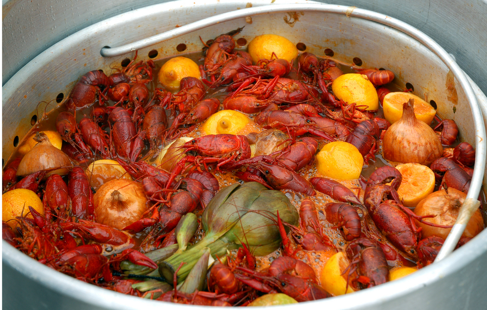 Crawfish, vegetables and seasonings are all thrown in a pot showing off new Orleans' cuisine