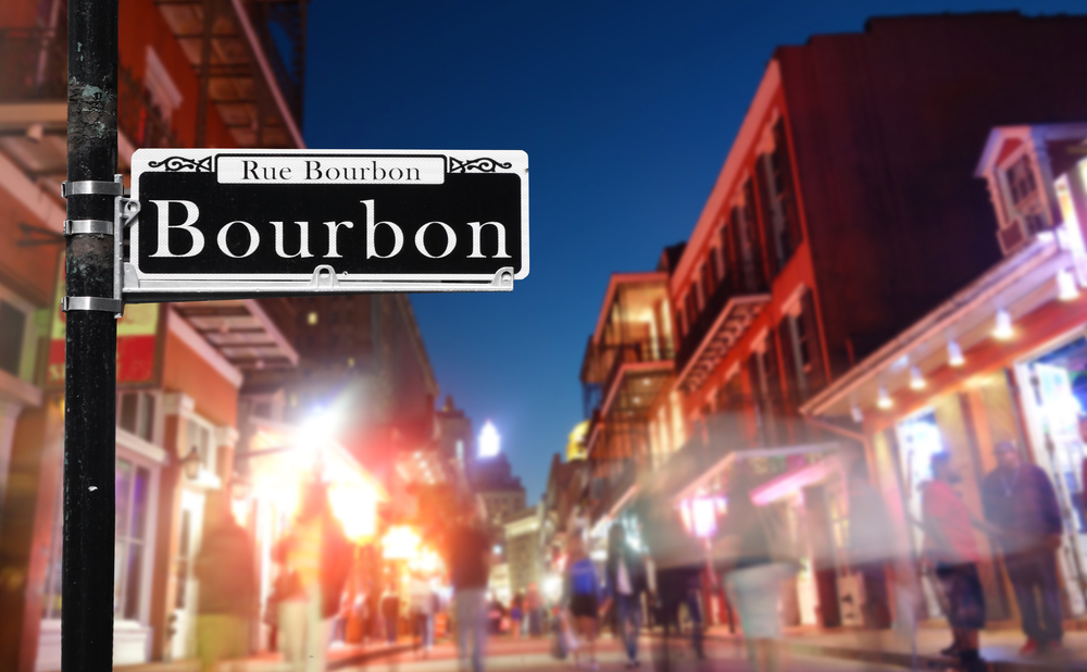 A street view of Bourbon Street showcasing New Orleans' vibrant nightlife