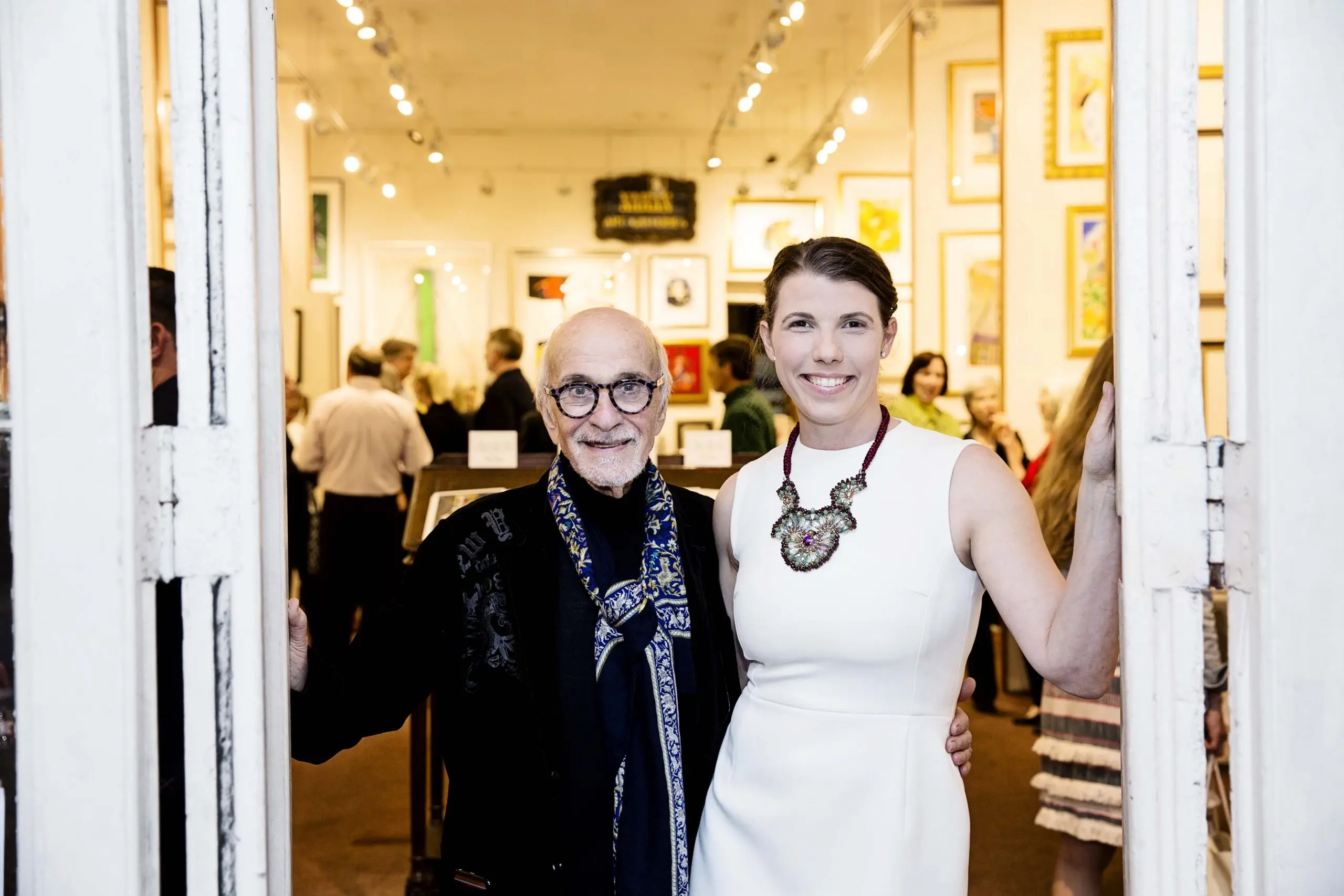 elliott-gallery Welcoming guests: gallery owners greet visitors at the entrance of Elliott Gallery, a fine art gallery in New Orleans' French Quarter
